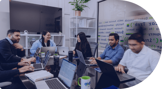 People in a meeting collaborating around a table