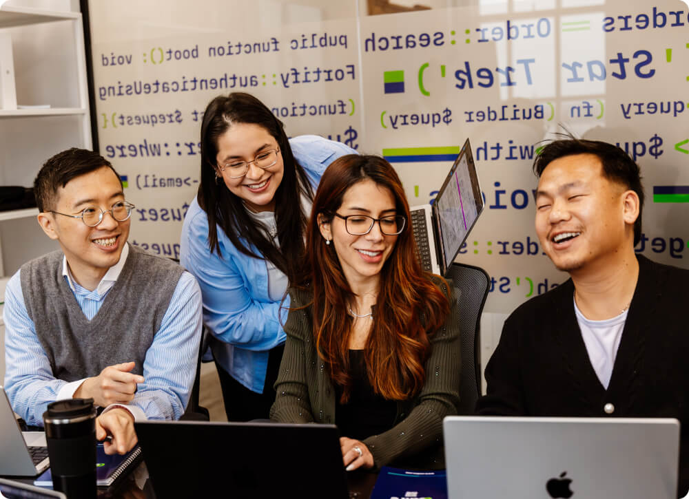 Colleagues having a conversation in a collaborative workspace